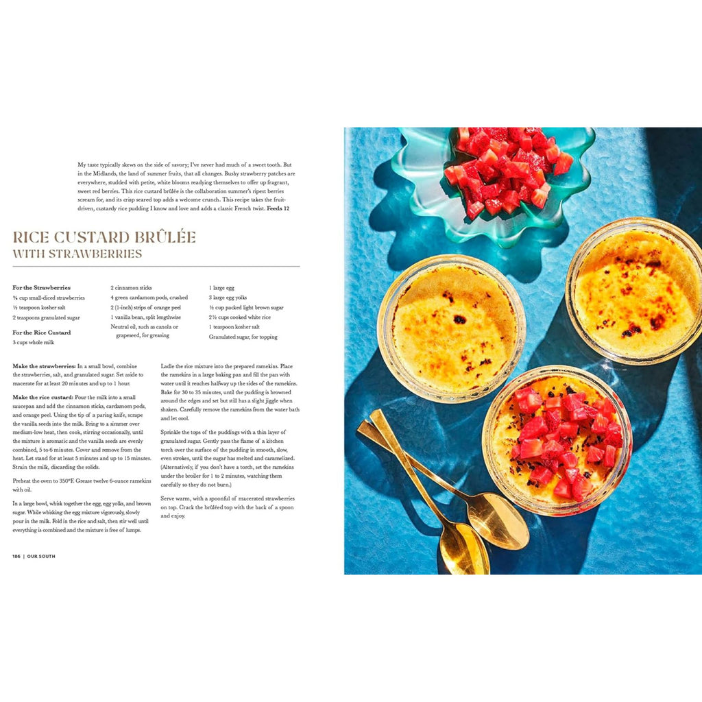 A culinary spread from "Our South: Black Food Through My Lens" by Gneiss Spice features a dessert recipe for rice custard brûlée with strawberries, inspired by Southern cuisine. To the right, three servings garnished with diced strawberries rest on a blue surface, accompanied by two gold spoons.