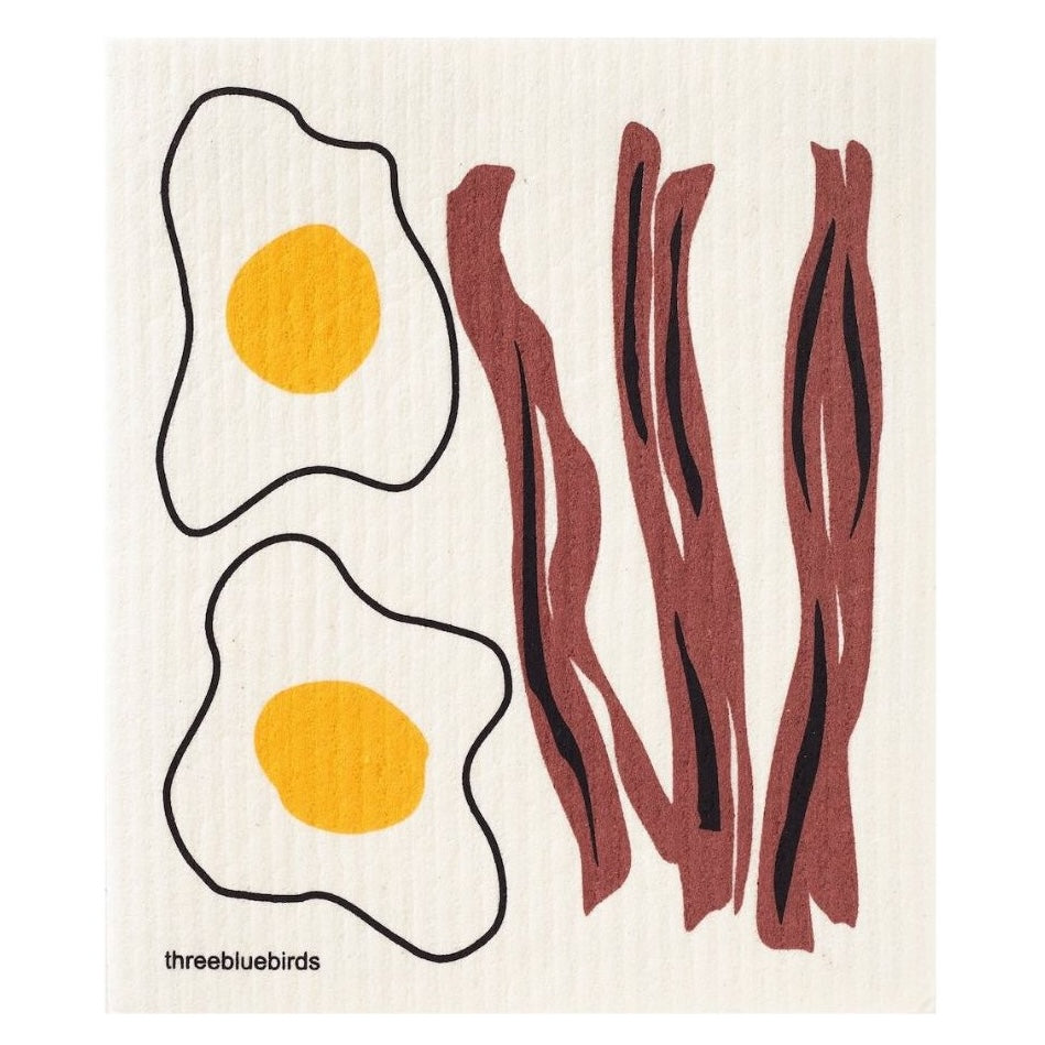 A stylized illustration of two fried eggs with yellow yolks alongside three strips of bacon, all outlined in black on a white background, similar to the charming patterns found on the Gneiss Spice's Swedish Dishcloth — Eggs & Bacon.