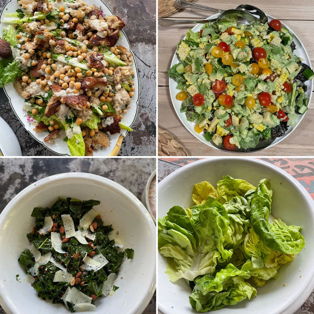 A medley of four salads from Gneiss Spice's cookbook, "What Goes With What: 100 Recipes, 20 Charts, Endless Possibilities," featuring a roasted vegetable and chickpea creation, a tomato and avocado blend with spinach, a kale salad accented with cheese shavings and nuts, and a colorful bowl of fresh lettuce leaves—all designed to inspire your culinary creations.