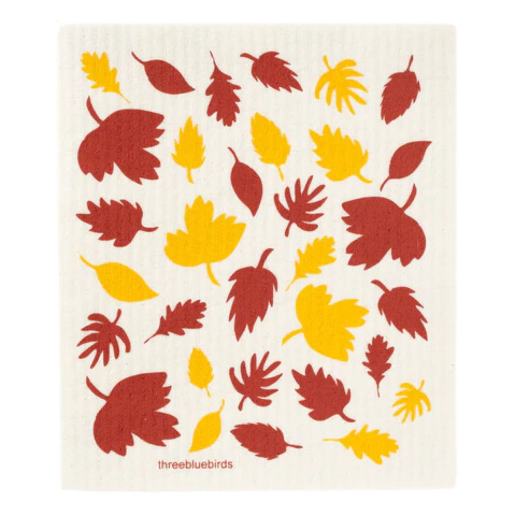 Introducing the Gneiss Spice Swedish Dishcloth — Fall Foliage, an eco-friendly cleaning essential featuring a charming pattern of red and yellow autumn leaves on a white background. This beautifully designed dishcloth is crafted in the traditional Swedish style, offering exceptional absorbency for everyday cleaning tasks.