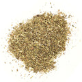 A pile of Gneiss Spice Italian Herbs (Salt-Free) on a white background shows finely chopped green and brown leaves with an uneven, flaky texture—perfect for enhancing your favorite dishes.