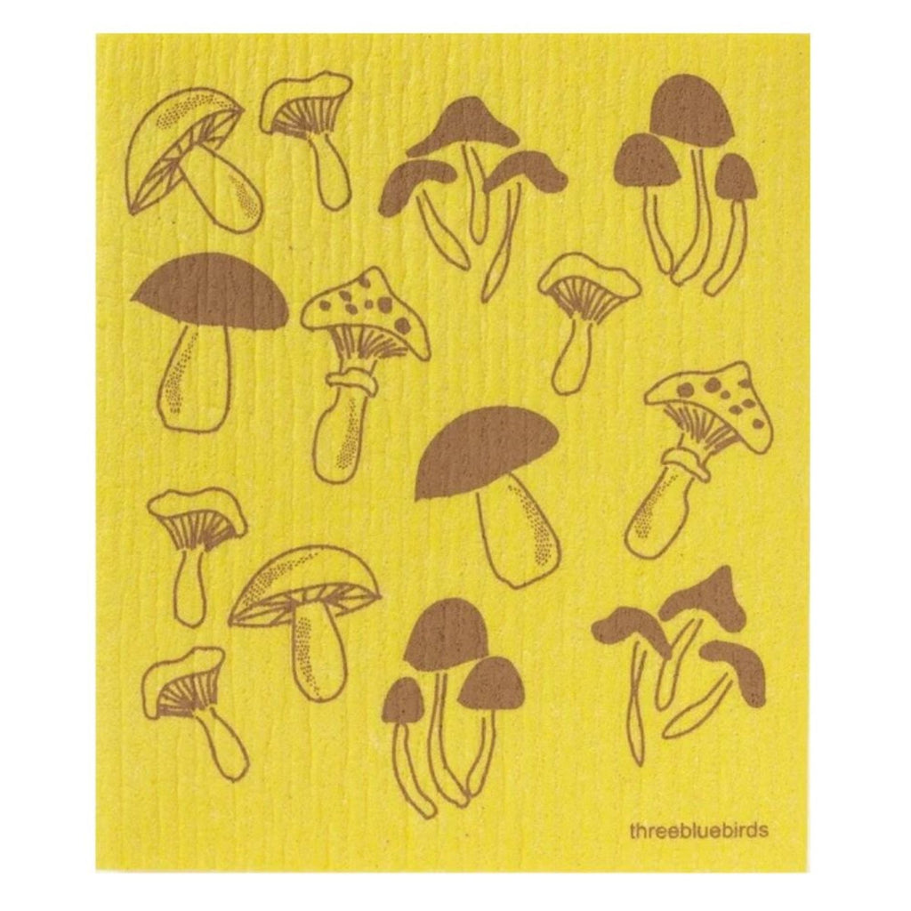 The Swedish Dishcloth — Mushroom by Gneiss Spice features an illustration of various brown mushrooms in diverse shapes and sizes, randomly arranged across the yellow surface. This eco-friendly cloth offers a sustainable solution for your cleaning needs.