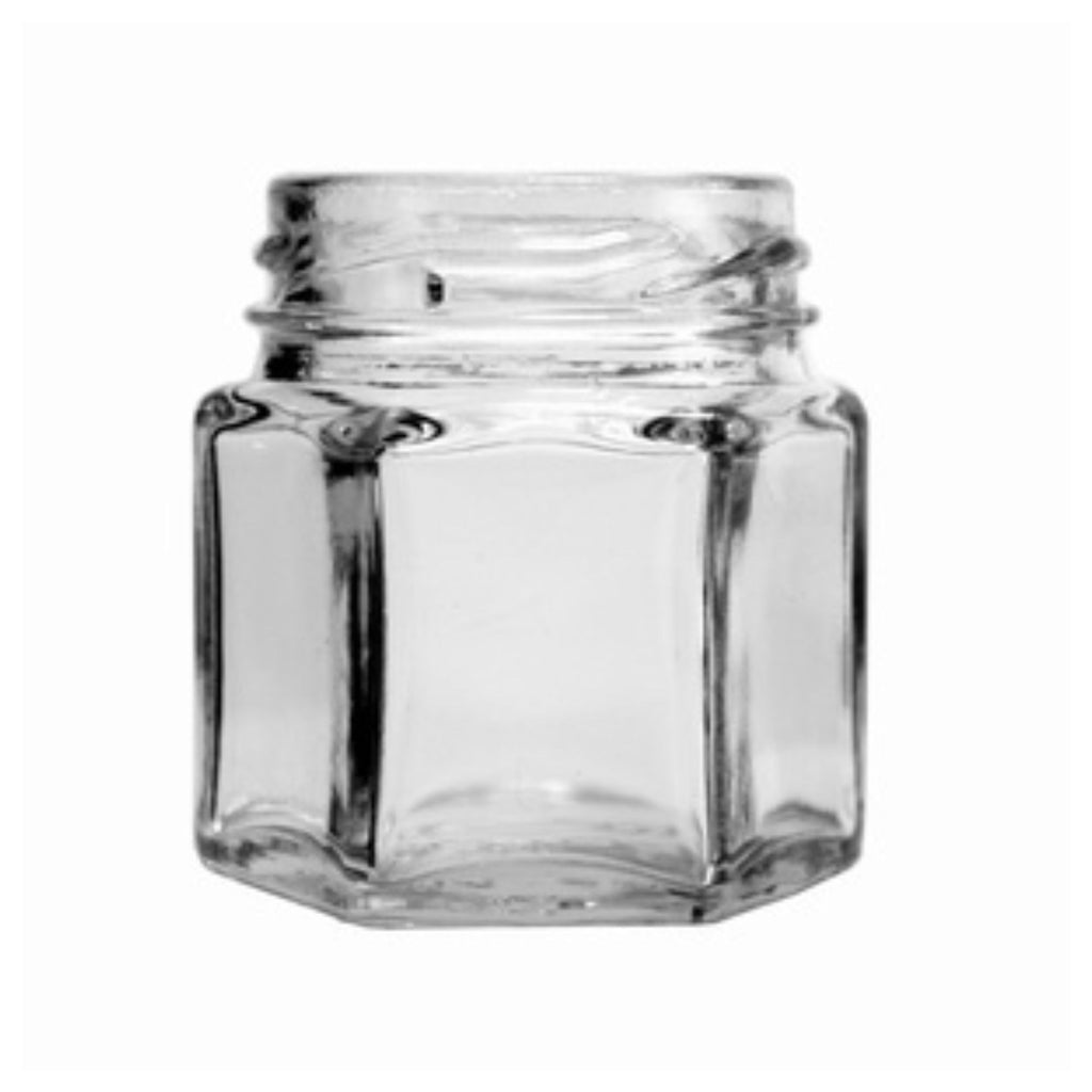 The Replacement Component: Glass Jar (No Lid) from Gneiss Spice, a small and empty hexagonal glass jar with an open top, is elegantly displayed against a plain white background.