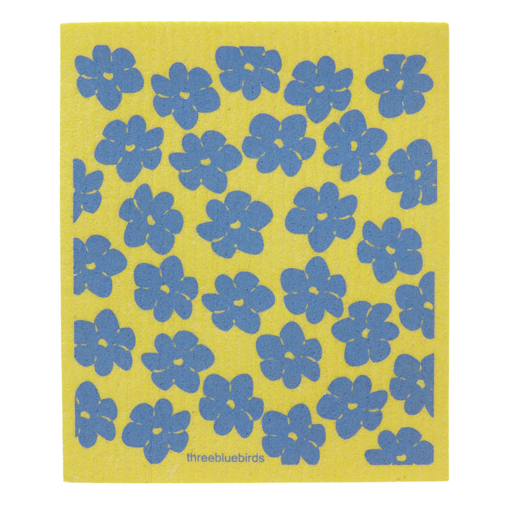 A Swedish dishcloth in yellow, adorned with a pattern of blue flowers evenly distributed across its surface. The brand name "Gneiss Spice" appears at the bottom center, offering an eco-friendly and sustainable solution for your cleaning needs.