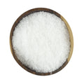 A round wooden bowl filled to the top with Gneiss Spice Salt — Sea Salt Kosher (Flake), viewed from above against a white background.