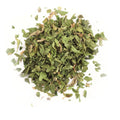 A small pile of finely chopped Gneiss Spice Parsley Leaf sits on a white background.